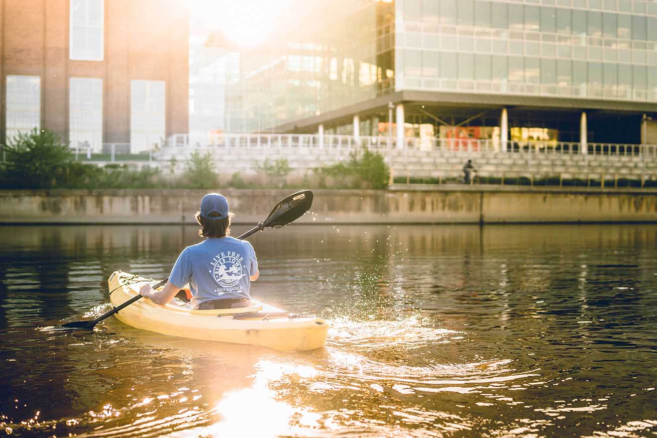 person kayaking on the Grand River in Lansing